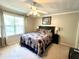 Bedroom featuring a ceiling fan, a window, and a patterned comforter at 2040 Rondo St # H, Charleston, SC 29414