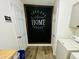 Charming laundry room featuring a chalkboard wall between two doorways at 2040 Rondo St # H, Charleston, SC 29414