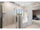 Bathroom with white tiled shower, a separate soaking tub, and a window offering natural light at 206 Red Bluff St, Summerville, SC 29483
