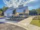 Community clubhouse featuring modern architecture, landscaping, and a pool area at 206 Red Bluff St, Summerville, SC 29483