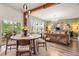 Bright open-concept living and dining area with wood floors and exposed beam at 206 Red Bluff St, Summerville, SC 29483