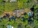Breathtaking aerial view highlighting the home's unique architectural design, landscaping, and inviting pool area at 207 Central Ave, Summerville, SC 29483