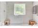 Bright bathroom featuring gray tile, a mosaic glass window, and modern fixtures in a spa-like setting at 207 Central Ave, Summerville, SC 29483
