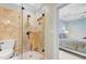 Updated bathroom featuring a tiled shower with glass door, and access to the bedroom at 207 Central Ave, Summerville, SC 29483