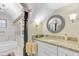 Bright bathroom featuring granite counters, decorative mirror, and a tub and shower combo at 207 Central Ave, Summerville, SC 29483