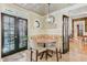 Charming breakfast nook with cushioned seating, natural light and access to exterior at 207 Central Ave, Summerville, SC 29483