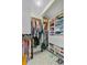 Well-organized walk-in closet with custom shelving, hanging racks, and ample storage space at 207 Central Ave, Summerville, SC 29483