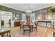 Formal dining room featuring a large table, chandelier, and patterned wallpaper at 207 Central Ave, Summerville, SC 29483