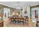 Elegant dining room boasts a large dining table, a fireplace, and chandelier lighting at 207 Central Ave, Summerville, SC 29483