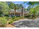 Charming brick home with a welcoming front porch and meticulously maintained landscaping at 207 Central Ave, Summerville, SC 29483