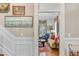 Elegant home showcasing a living room view from the foyer, featuring hardwood floors, stylish furniture, and décor at 207 Central Ave, Summerville, SC 29483