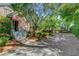 Charming brick home with a welcoming front entrance and well-maintained landscaping and gravel driveway at 207 Central Ave, Summerville, SC 29483