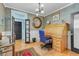 Inviting home office with hardwood floors, custom wainscoting and a stylish wooden desk at 207 Central Ave, Summerville, SC 29483