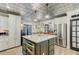 Spacious kitchen with large island, stainless appliances, ample storage, and decorative ceiling at 207 Central Ave, Summerville, SC 29483