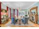 Elegant living room features hardwood floors, a crystal chandelier, and a decorative fireplace at 207 Central Ave, Summerville, SC 29483