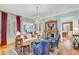 Cozy living room boasts hardwood floors, a fireplace, and a view into additional living space at 207 Central Ave, Summerville, SC 29483