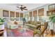 Comfortable living room with a ceiling fan and multiple windows providing natural light at 207 Central Ave, Summerville, SC 29483