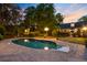 A backyard pool with an evening sky with beautiful landscaping at 207 Central Ave, Summerville, SC 29483