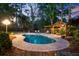 Backyard pool and outdoor area with a covered patio, perfect for entertaining or relaxing at 207 Central Ave, Summerville, SC 29483