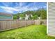 Fenced backyard with a grass lawn for outdoor activities and privacy at 209 Killarney Trl, Moncks Corner, SC 29461