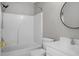 Bathroom featuring a shower-tub combo, white vanity, toilet, and round mirror at 209 Killarney Trl, Moncks Corner, SC 29461
