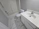 Small bathroom featuring a tub/shower combo, white vanity, and marble patterned flooring at 209 Killarney Trl, Moncks Corner, SC 29461