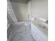 Cozy bathroom with a tub/shower, white vanity, and marble-patterned flooring at 209 Killarney Trl, Moncks Corner, SC 29461