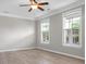 Bedroom with windows and new flooring, creating a peaceful retreat at 209 Killarney Trl, Moncks Corner, SC 29461