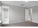 Bedroom featuring carpet, neutral walls, and doorways to a bathroom and hallway at 209 Killarney Trl, Moncks Corner, SC 29461