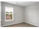 Bedroom with a large window, neutral walls, and carpet at 209 Killarney Trl, Moncks Corner, SC 29461