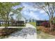 Welcoming entryway leading to a community clubhouse with scenic views of the lake and meticulously manicured landscaping at 209 Killarney Trl, Moncks Corner, SC 29461