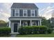 Charming two-story home with a covered front porch and well-maintained landscaping at 209 Killarney Trl, Moncks Corner, SC 29461