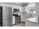 Modern kitchen equipped with stainless steel appliances and light stone countertops at 209 Killarney Trl, Moncks Corner, SC 29461