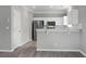 Well-lit kitchen featuring white cabinets and stainless steel appliances at 209 Killarney Trl, Moncks Corner, SC 29461