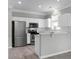 Charming kitchen with white cabinets and stainless steel appliances at 209 Killarney Trl, Moncks Corner, SC 29461