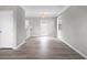 Bright living room featuring modern gray walls, stylish flooring, and a rear entry door at 209 Killarney Trl, Moncks Corner, SC 29461