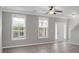 Spacious living area with large windows, new floors, and crown molding at 209 Killarney Trl, Moncks Corner, SC 29461