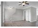 An open living space features modern flooring, a ceiling fan, and ample lighting at 209 Killarney Trl, Moncks Corner, SC 29461