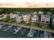Captivating aerial view of a luxury waterfront neighborhood with private docks, lush greenery, and stunning coastline at 21 Morgan Place Dr, Isle of Palms, SC 29451