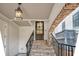 Beautiful entryway featuring brick stairs, wrought iron railings, and a stylish front door at 21 Morgan Place Dr, Isle of Palms, SC 29451