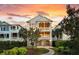 Charming home with lush landscaping and a welcoming stone pathway at 21 Morgan Place Dr, Isle of Palms, SC 29451