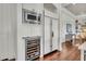 Modern kitchen includes stainless steel appliances, a wine cooler and beautiful wood floors at 21 Morgan Place Dr, Isle of Palms, SC 29451