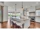 Bright, open kitchen with a large center island, stainless steel appliances, and pendant lighting at 21 Morgan Place Dr, Isle of Palms, SC 29451
