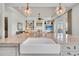 A view from the kitchen of the open-concept living area and its beautifully designed features at 21 Morgan Place Dr, Isle of Palms, SC 29451