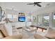 Bright living room with white built-in cabinetry, a beachy decor, and French doors leading to a patio at 21 Morgan Place Dr, Isle of Palms, SC 29451