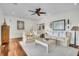 Inviting living room featuring hardwood floors, a neutral color scheme, and a ceiling fan at 21 Morgan Place Dr, Isle of Palms, SC 29451