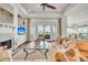 Spacious living room with fireplace, built-in shelving, and glass doors to the outside at 21 Morgan Place Dr, Isle of Palms, SC 29451