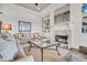 Comfortable living room featuring a fireplace and built-in shelving for a stylish and cozy aesthetic at 21 Morgan Place Dr, Isle of Palms, SC 29451
