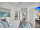 Cozy main bedroom with a glimpse into an en suite bathroom and staircase at 21 Morgan Place Dr, Isle of Palms, SC 29451