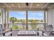 Enjoy the beautiful views from this covered porch with seating and a waterfront outlook at 21 Morgan Place Dr, Isle of Palms, SC 29451